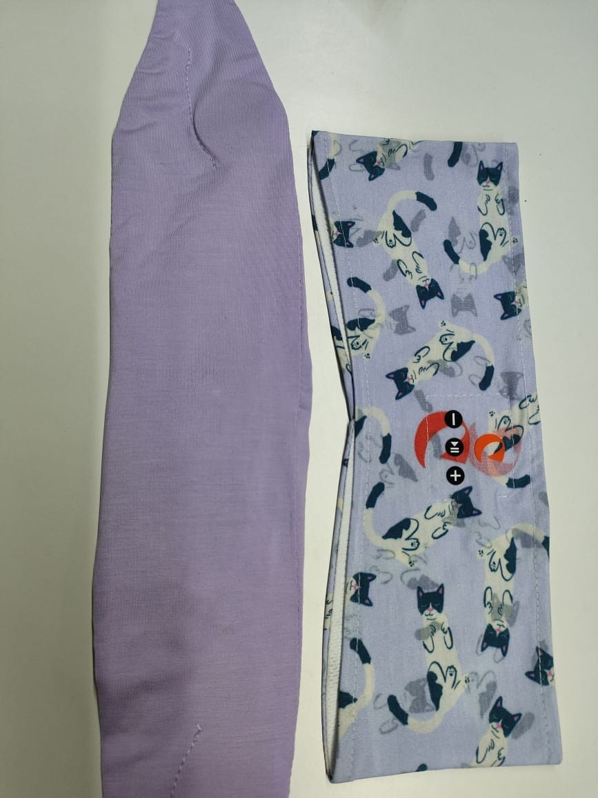 We decided against the lilac, we will go with the cat design and another plain navy to match the cat's tail and head.