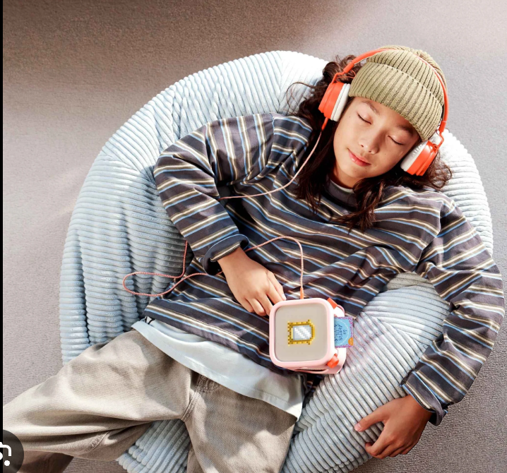 Headphones on, card in, gone.