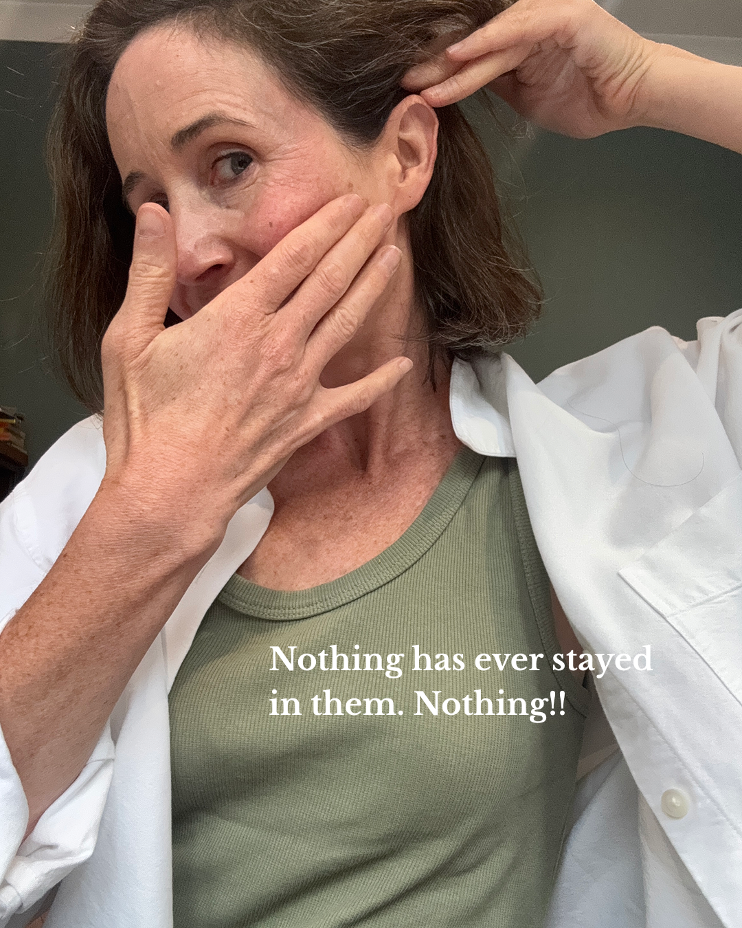 kim-nothing-stays-in.jpg — hand at face